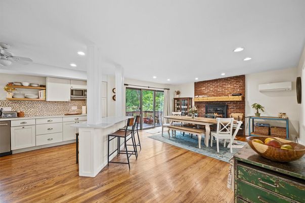 Dining room, Fireplace, Interior, Kitchen, Recessed Lighting, Stainless Steel Appliances, Stone Walls, Wood Texture Flooring