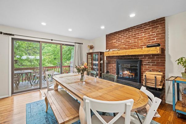 Dining room, Fireplace, Interior, Recessed Lighting, Stone Walls, Wood Texture Flooring