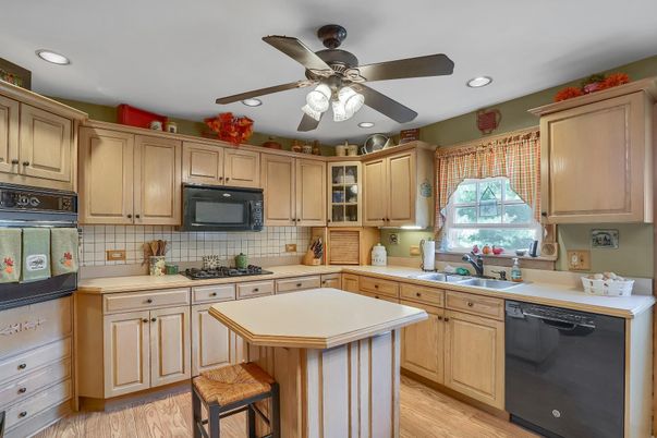 Interior, Kitchen, Recessed Lighting, Tile Countertops, Wood Texture Flooring