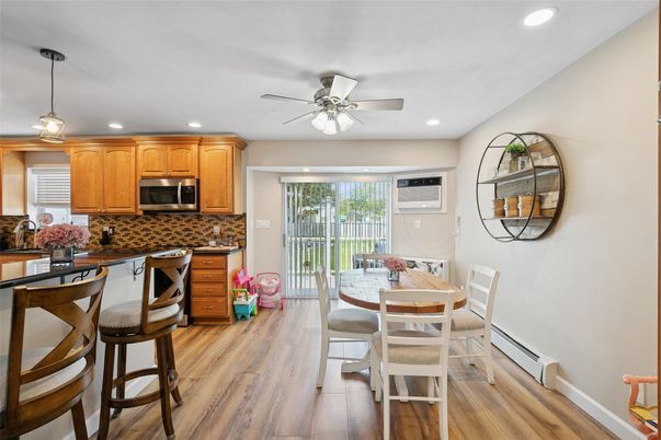 Dining room, Interior, Kitchen, Pendant Lights, Recessed Lighting, Stainless Steel Appliances, Wood Texture Flooring