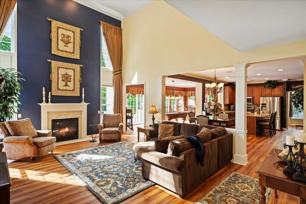 Chandelier, Dining room, Fireplace, Interior, Kitchen, Living room, Pendant Lights, Recessed Lighting, Stainless Steel Appliances, Wood Texture Flooring