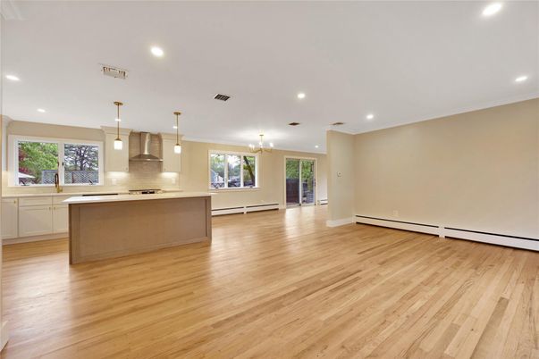 Empty room, Interior, Kitchen, Pendant Lights, Recessed Lighting, Stainless Steel Appliances, Wood Texture Flooring