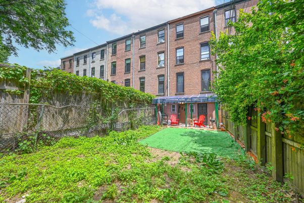 Backyard, Exterior, Facade, Brick Facade, Condo Building