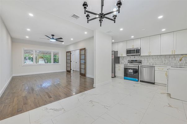 Interior, Kitchen, Marble, Pendant Lights, Recessed Lighting, Stainless Steel Appliances, Wood Texture Flooring