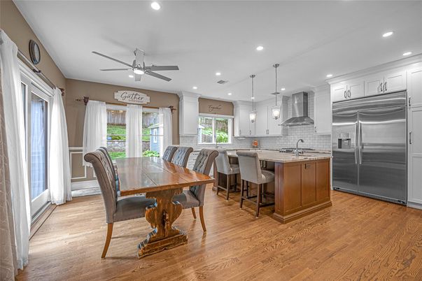 Dining room, Interior, Kitchen, Pendant Lights, Recessed Lighting, Stainless Steel Appliances, Wood Texture Flooring