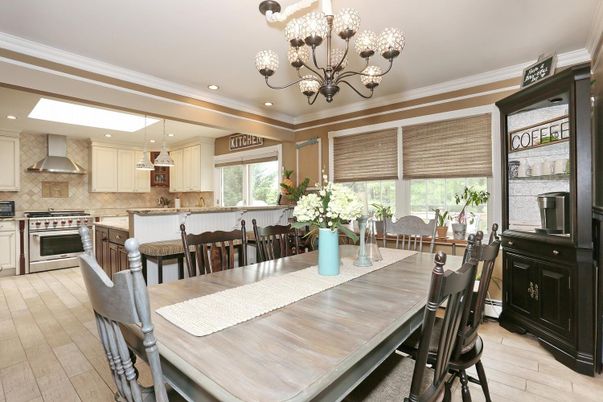 Chandelier, Dining room, Interior, Kitchen, Pendant Lights, Recessed Lighting, Stainless Steel Appliances, Wood Texture Flooring