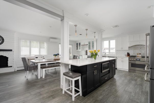 Dining room, Fireplace, Interior, Kitchen, Pendant Lights, Recessed Lighting, Stainless Steel Appliances, Wood Texture Flooring