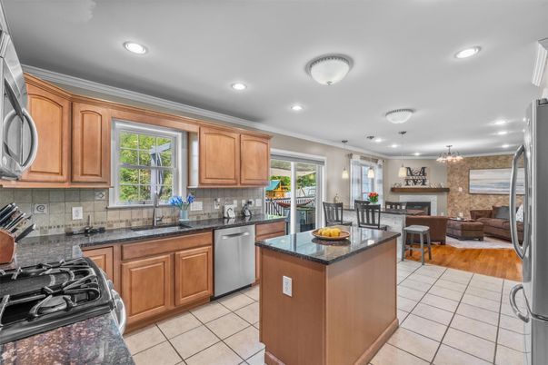 Dining room, Fireplace, Interior, Kitchen, Living room, Pendant Lights, Recessed Lighting, Stainless Steel Appliances, Wood Texture Flooring