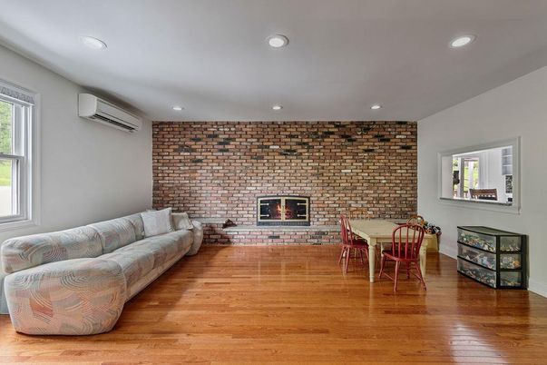 Dining room, Fireplace, Interior, Recessed Lighting, Stone Walls, Wood Texture Flooring
