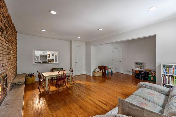 Dining room, Fireplace, Interior, Recessed Lighting, Stone Walls, Wood Texture Flooring