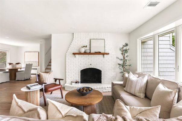 Dining room, Fireplace, Interior, Living room, Recessed Lighting, Stone Walls, Wood Texture Flooring