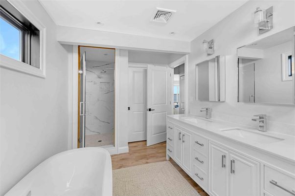 Bathroom, Dual Sink Vanities, Free Standing Baths, Interior, Marble Walls, Wood Texture Flooring
