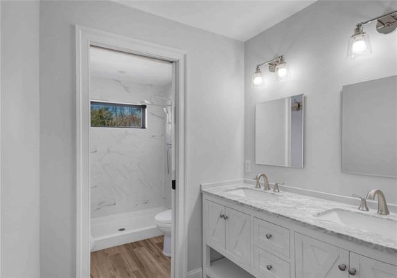 Bathroom, Dual Sink Vanities, Interior, Marble Walls, Wood Texture Flooring