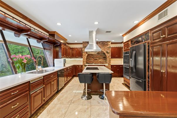 Fireplace, Interior, Kitchen, Recessed Lighting, Stainless Steel Appliances, Stone Walls