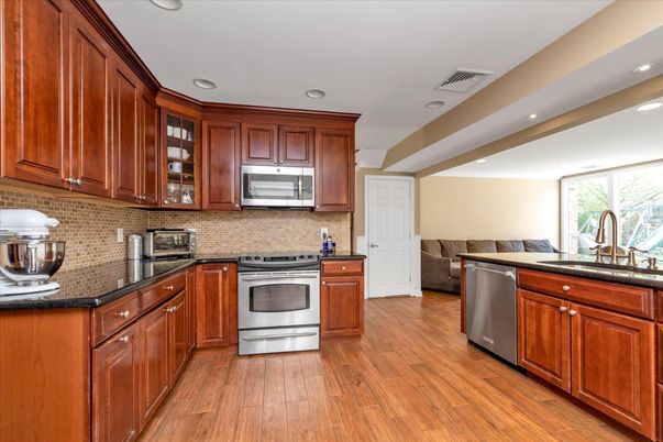 Interior, Kitchen, Recessed Lighting, Stainless Steel Appliances, Wood Texture Flooring
