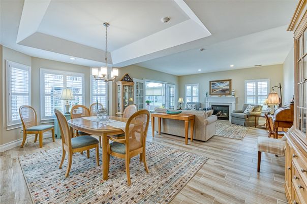 Chandelier, Dining room, Fireplace, Interior, Living room, Pendant Lights, Recessed Lighting, Wood Texture Flooring