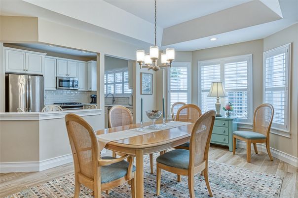 Chandelier, Dining room, Interior, Kitchen, Pendant Lights, Recessed Lighting, Stainless Steel Appliances, Wood Texture Flooring