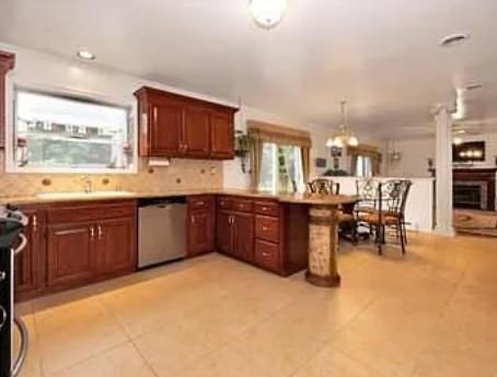 Chandelier, Dining room, Fireplace, Interior, Kitchen, Pendant Lights, Recessed Lighting, Stainless Steel Appliances
