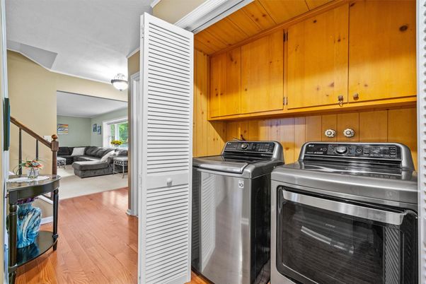 Interior, Living room, Utility Closets, Washer, Wood Texture Flooring