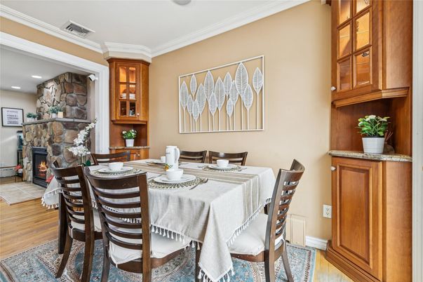 Dining room, Fireplace, Interior, Recessed Lighting, Stone Walls, Wood Texture Flooring