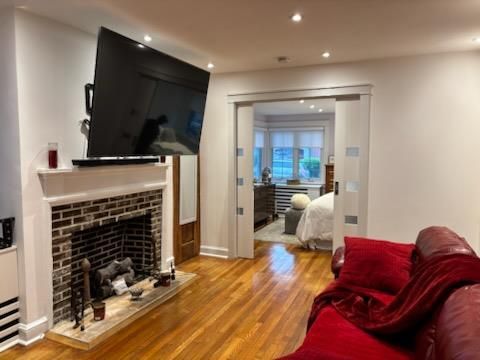Bedroom, Fireplace, Interior, Recessed Lighting, Wood Texture Flooring
