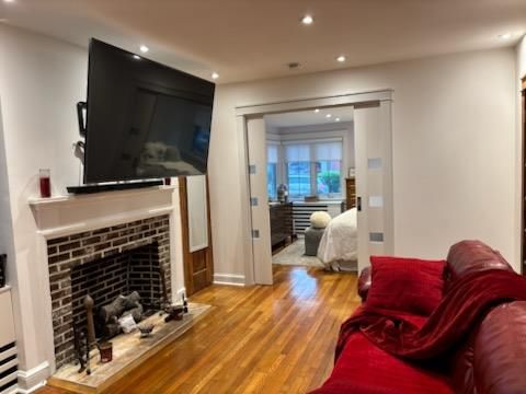 Bedroom, Fireplace, Interior, Living room, Recessed Lighting, Wood Texture Flooring