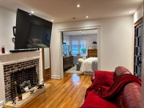 Bedroom, Fireplace, Interior, Living room, Recessed Lighting, Wood Texture Flooring