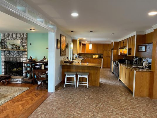 Fireplace, Interior, Kitchen, Pendant Lights, Recessed Lighting, Stone Walls, Wood Texture Flooring