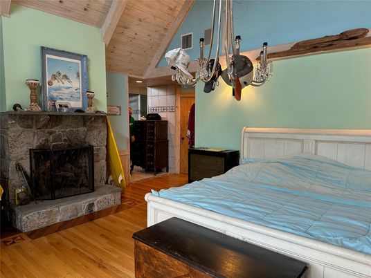 Bedroom, Chandelier, Fireplace, Interior, Recessed Lighting, Wooden Ceilings, Wood Texture Flooring