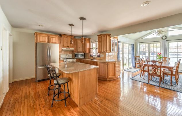 Dining room, Interior, Kitchen, Pendant Lights, Recessed Lighting, Stainless Steel Appliances, Wood Texture Flooring