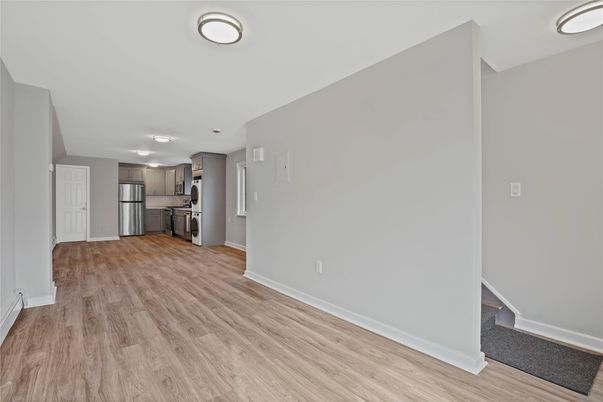 Empty room, Interior, Kitchen, Stainless Steel Appliances, Wood Texture Flooring