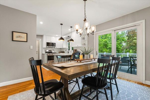 Chandelier, Dining room, Interior, Kitchen, Pendant Lights, Recessed Lighting, Stainless Steel Appliances, Wood Texture Flooring