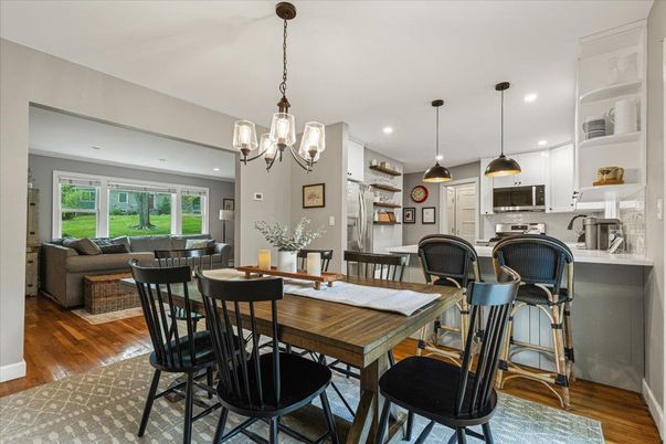 Chandelier, Dining room, Interior, Kitchen, Living room, Pendant Lights, Recessed Lighting, Stainless Steel Appliances, Wood Texture Flooring