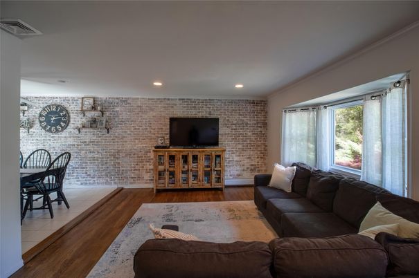 Dining room, Interior, Living room, Recessed Lighting, Stone Walls, Wood Texture Flooring