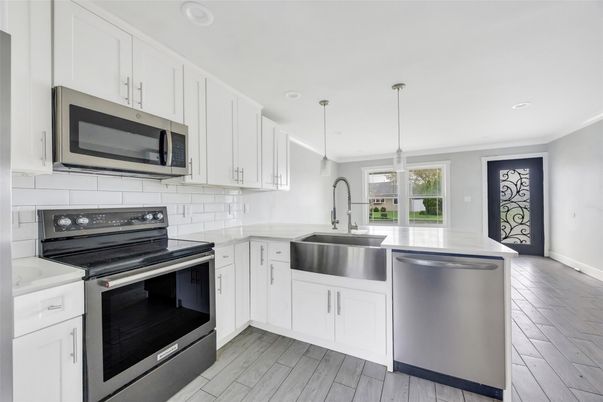 Interior, Kitchen, Pendant Lights, Recessed Lighting, Stainless Steel Appliances, Wood Texture Flooring