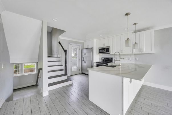 Interior, Kitchen, Pendant Lights, Recessed Lighting, Stainless Steel Appliances, Wood Texture Flooring