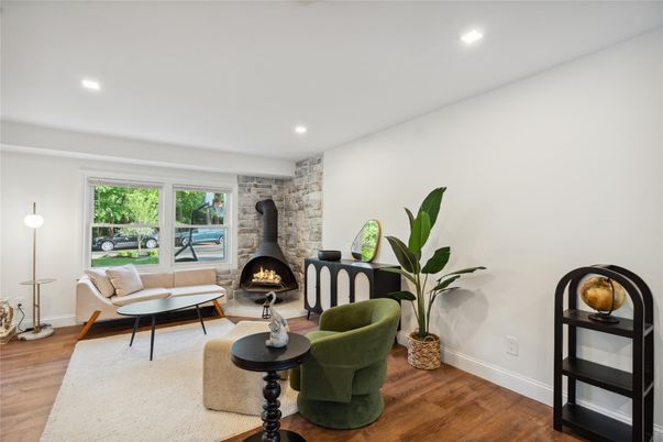 Fireplace, Interior, Living room, Recessed Lighting, Stone Walls, Wood Texture Flooring