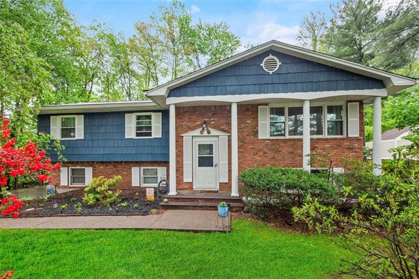 Exterior, Facade, Brick Facade, Raised Ranch