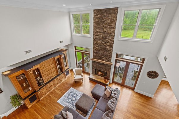Fireplace, Interior, Living room, Recessed Lighting, Stone Walls, Wood Texture Flooring