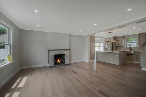 Empty room, Fireplace, Interior, Kitchen, Pendant Lights, Recessed Lighting, Wood Texture Flooring