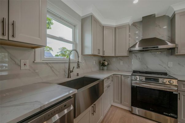 Interior, Kitchen, Marble Walls, Recessed Lighting, Stainless Steel Appliances, Wood Texture Flooring