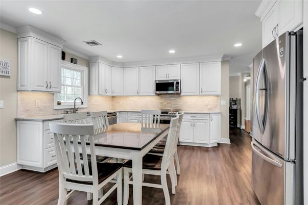 Dining room, Interior, Kitchen, Recessed Lighting, Stainless Steel Appliances, Wood Texture Flooring