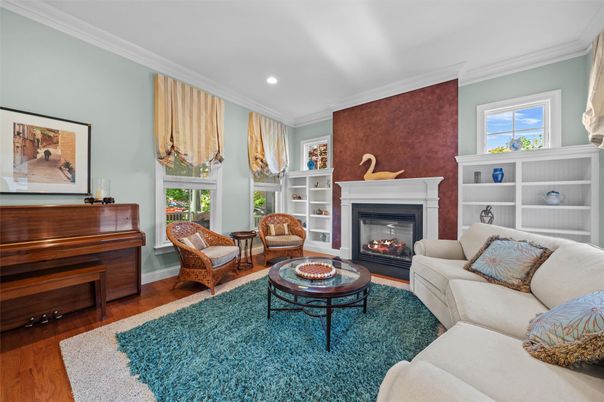 Fireplace, Interior, Living room, Piano, Recessed Lighting, Wood Texture Flooring