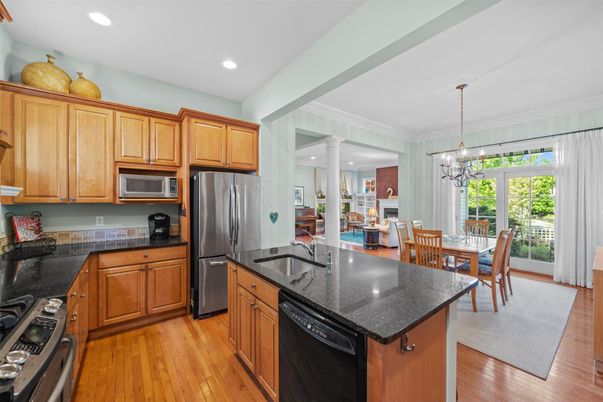 Dining room, Interior, Kitchen, Pendant Lights, Recessed Lighting, Stainless Steel Appliances, Wood Texture Flooring