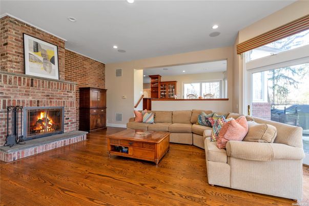 Fireplace, Interior, Living room, Recessed Lighting, Stone Walls, Wood Texture Flooring