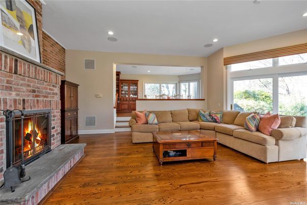 Fireplace, Interior, Living room, Recessed Lighting, Stone Walls, Wood Texture Flooring