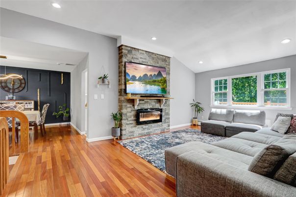 Dining room, Fireplace, Interior, Living room, Recessed Lighting, Wood Texture Flooring