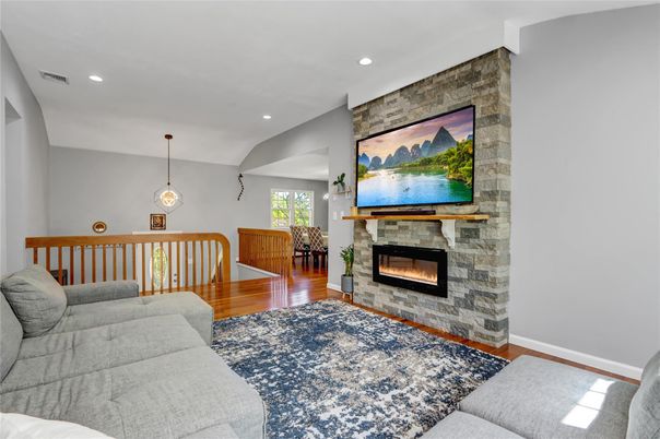 Fireplace, Interior, Living room, Pendant Lights, Recessed Lighting, Stone Walls, Wood Texture Flooring