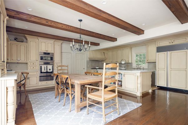 Chandelier, Dining room, Interior, Kitchen, Recessed Lighting, Stainless Steel Appliances, Wooden Beams, Wood Texture Flooring