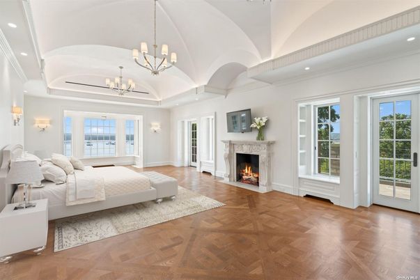 Bedroom, Chandelier, Fireplace, Interior, Recessed Lighting, Wood Texture Flooring
